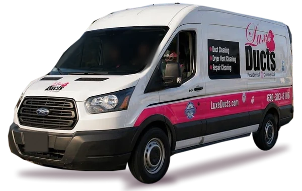 The white and pink Luxe Ducts service van